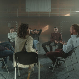 A group of people seated in a support circle